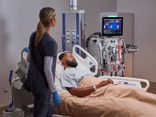 Dr checking patients monitor 